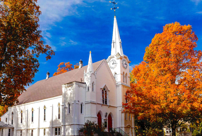 exterior photo of First Church in autumn